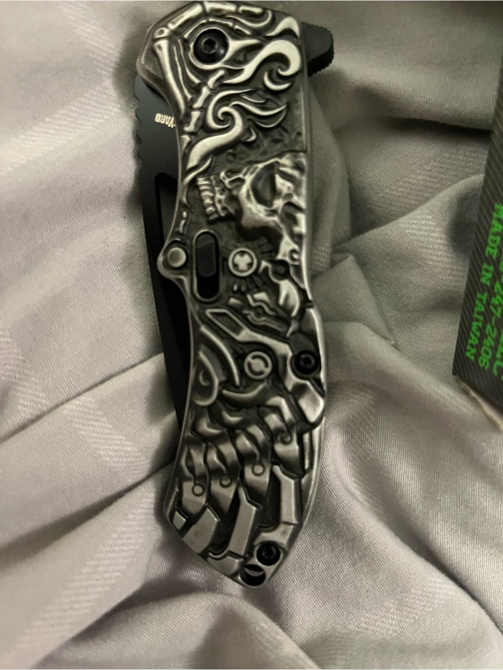 “lazy bones”. SCHA16B Skull-Engraved Folding Pocket Knife — Black and Silver
